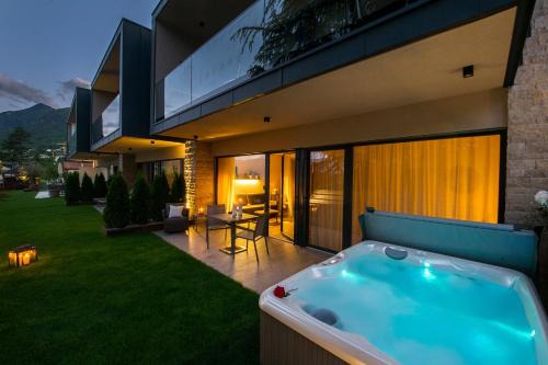 Caldaro Sulla Strada del Vino Apartment | Haus Gregori Modern & Central Stay in Vineyard with Rooftop & Served Breakfast