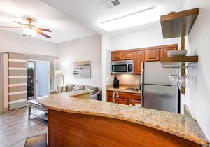 Dog-friendly, lakefront condo with WiFi, pool, hot tub, tennis, & beach access