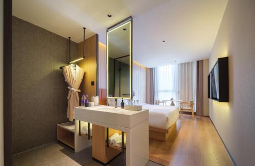 Hongqi District Hotel | 桔作酒店 新乡东站市政府店