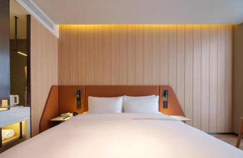 Hongqi District Hotel | 桔作酒店 新乡东站市政府店