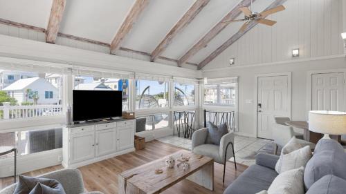 Seacrest House | Beach Retreat w Sundeck Golf Cart Bikes Bungalow House by AvantStay