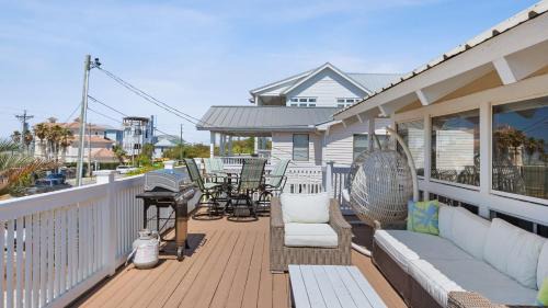 Seacrest House | Beach Retreat w Sundeck Golf Cart Bikes Bungalow House by AvantStay