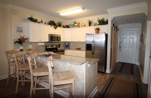 West Panama City Beach Condo | Emerald Isle 1406 - Front row beach chair service included! Affordable rates!