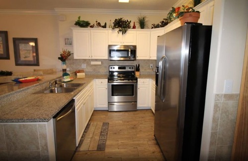 West Panama City Beach Condo | Emerald Isle 1406 - Front row beach chair service included! Affordable rates!