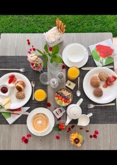 Caldaro Sulla Strada del Vino Apartment | Haus Gregori Modern & Central Stay in Vineyard with Rooftop & Served Breakfast