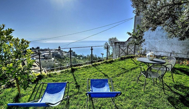 Villa Arletta: A characteristic two-story ancient house located on a hillside, facing the sea.
