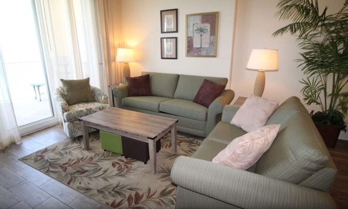 West Panama City Beach Condo | Emerald Isle 1406 - Front row beach chair service included! Affordable rates!